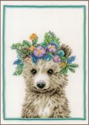 Orso con corona di fiori